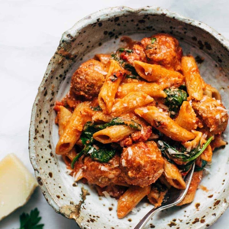 Baked penne with meatballs.