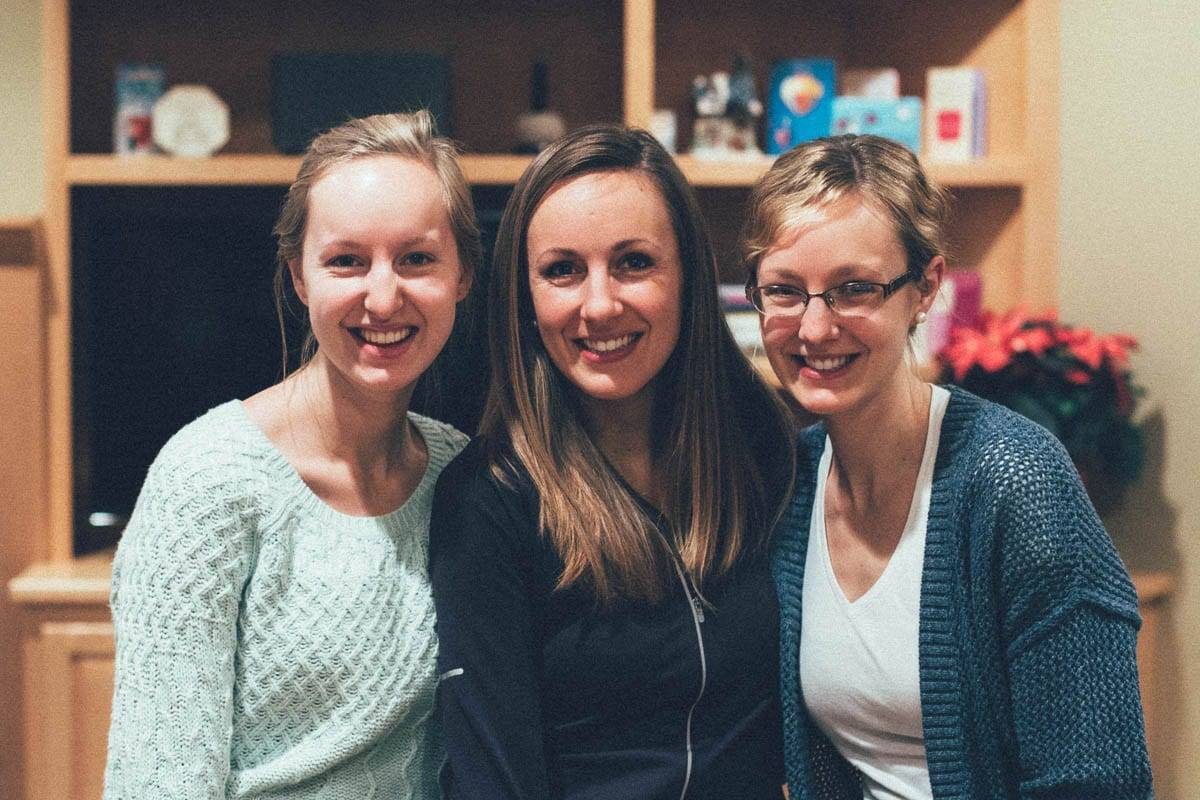 Three women smiling.