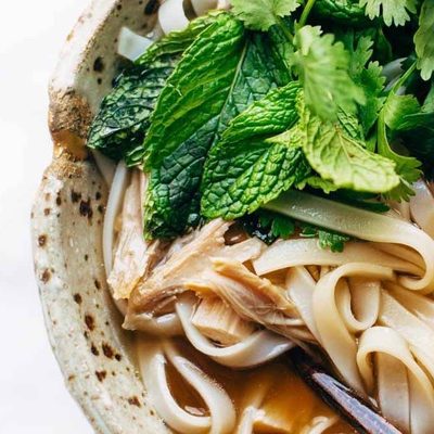 Turkey Pho in a bowl with chopsticks.