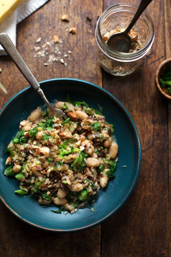 Broccoli Cheese Rice in a blue bowl with a fork.