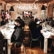 Group of friends at tables for a Christmas party.