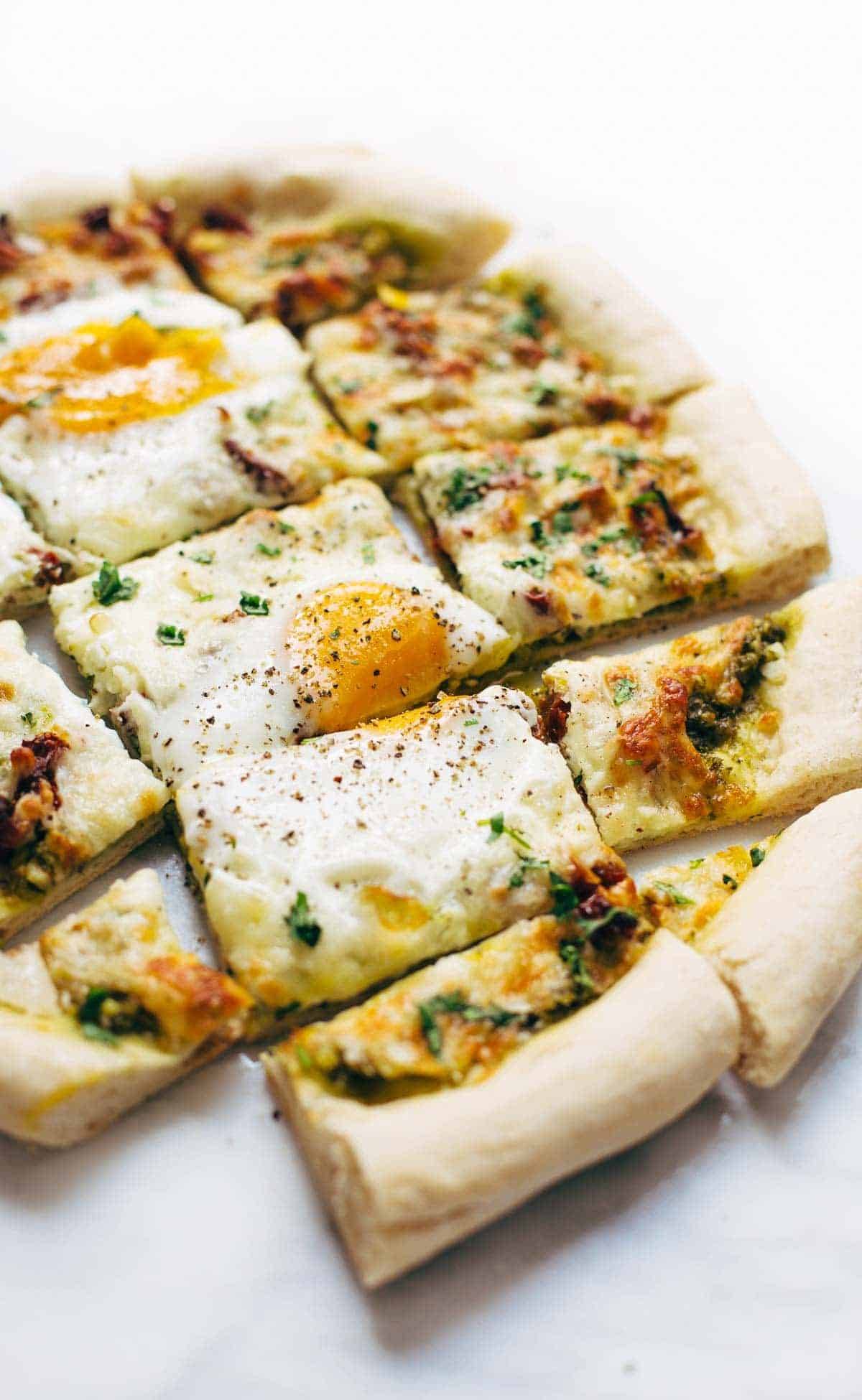 Breakfast Pizza cut into squares.
