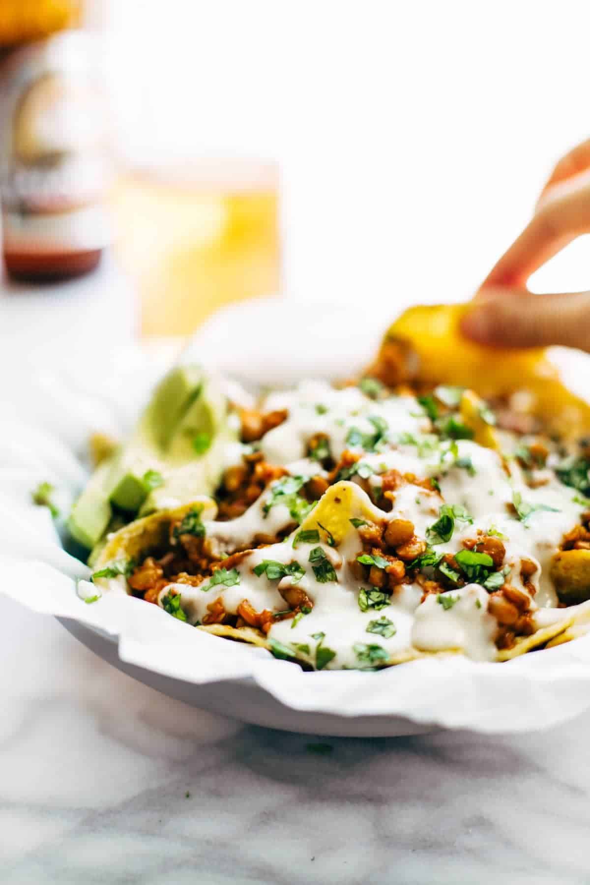 Spicy Lentil Nachos with Three Cheese Sauce - you will not believe how good these are! Saucy filling with a velvety homemade cheese sauce. Vegetarian. | pinchofyum.com Spicy Lentil Nachos with Three Cheese Sauce - you will not believe how good these are! Saucy filling with a velvety homemade cheese sauce. Vegetarian. | pinchofyum.com