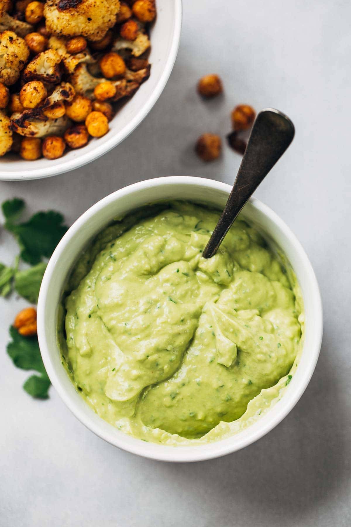 Avocado Dip in a bowl with a spoon.